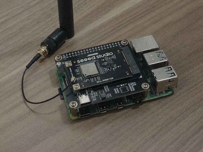 A photo of a Raspberry Pi 4 wearing a WM1302 Raspberry Pi Hat and a Seeed WiFi HaLow mini PCIe module