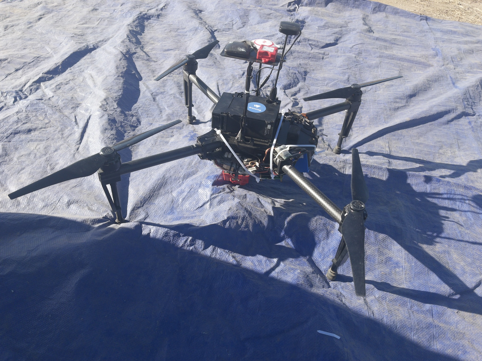digital agriculture project thumbnail featuring a drone on a blue tarp